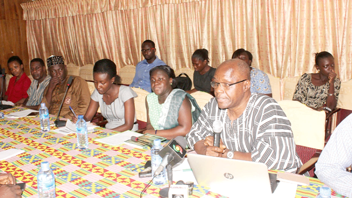 Mr Daniel Degbotse (with  microphone), Head of Monitoring and Evaluation of the Ministry of Health explaining a point during the dialogue. Picture: Nii  Martey Botchway 