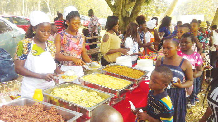 Orphans and vulnerable children being served at a party organised for them by an NGO, Building Lives Foundation, in Sunyani during Christmas