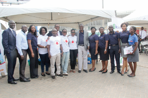  Staff of Access Bank, and members of Rotary Club in a pose with officials of the Korle Bu Blood Bank after the blood donation exercise