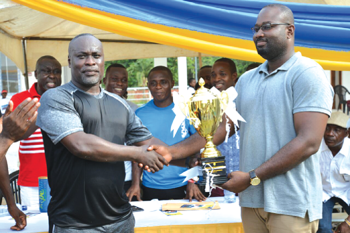  Chairman Maxwell Opoku receiving his trophy from Mr Appiah Kubi