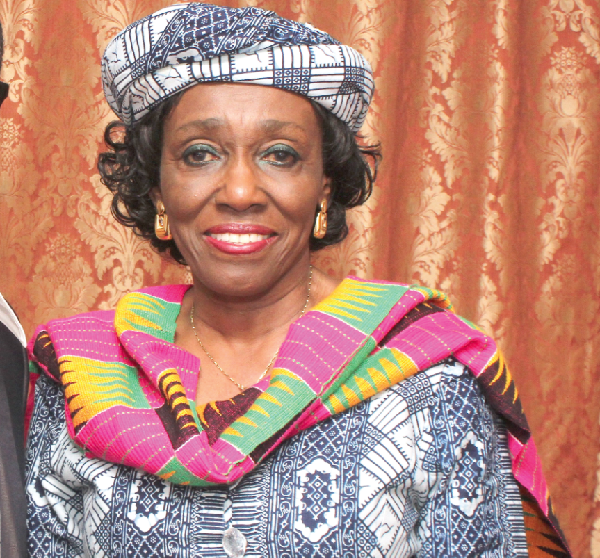  Nana Konadu Agyemang Rawlings (left) presenting a book titled ‘Women of distinction, Ghana’ to the Executive Director of W3, Miss Winnifred Selby