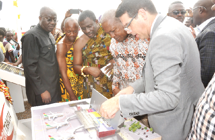 Mr Fabio Camara (right), Chief Executive, Contracta Engenharia LTDA, explaining a point to  President John Dramani Mahama on the Phase 2 of the Kumasi International Airport Project. Those looking on include the Tepamanhene, Nana Adusei Atwerewa Ampem (2nd left). Picture: EMMANUEL BAAH