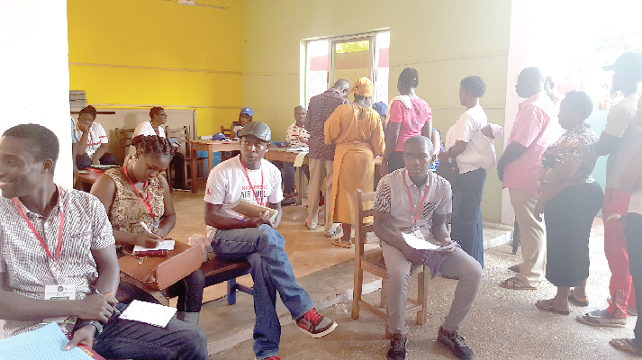  Party agents and voters at Ablekuma Home Care Polling Station at Dansoman in Accra