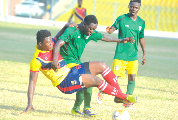 Hearts Musa Ibrahim (left) thrown off the ball by Aduana Stars Elvis during the match.  Picture credit: Emmanuel Quaye