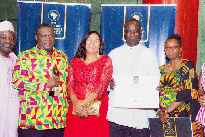 Mr Sylvanus Tamaklo (2nd from left), his wife Aisha and Ghana’s Permanent Representative to the ECOWAS, Mr William Awinador-Kanyinge, after receiving the award on behalf of Mrs Lordina Mahama. 