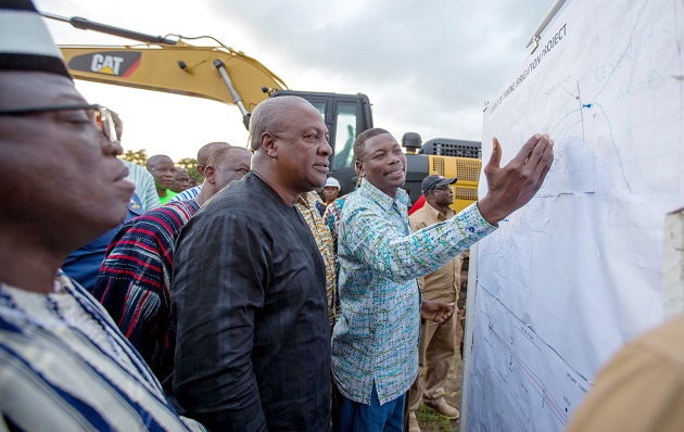 President Mahama having a look at the diagrams for the Tamne Irrigation Dam project. INSET: President Mahama breaking the ground for construction work on the Temne Irrigation Dam to begin.