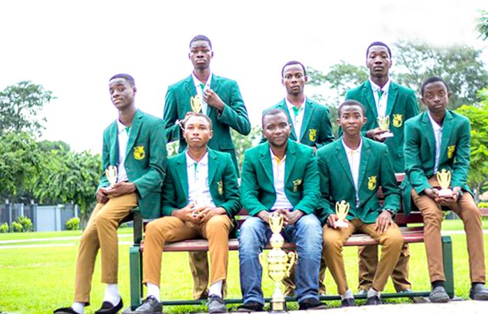 The Prempeh College champions, with Mr Peter Agyeman, the Robotics Team Tutor, seated in the middle