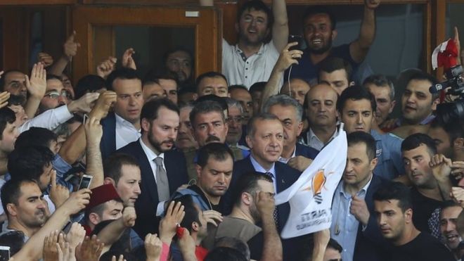 President Erdogan (centre) told his cheering supporters that the army must be cleansed