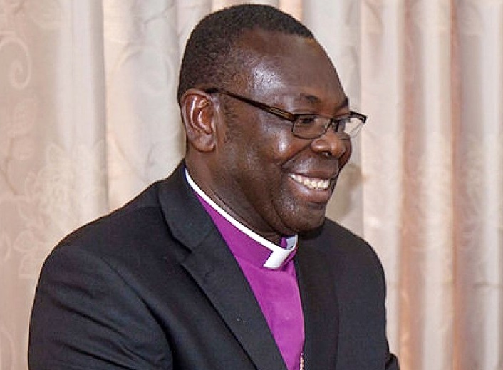 Rt Rev. Dr Agidi (2nd right) performing the ordination rites for the new pastors (left) 