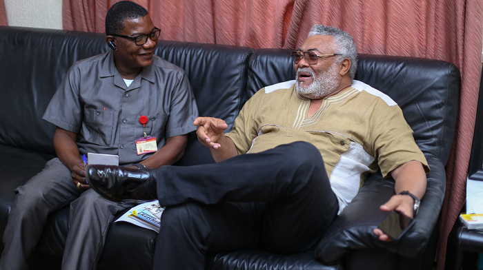 Mr Kobby Asmah (left), Editor of the Daily Graphic, sharing a joke with former President Rawlings during the interview