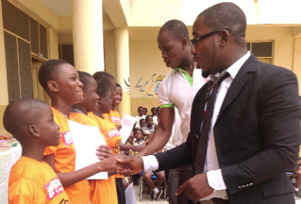The Headmaster of the school, Mr Mensah, leading staff members to congratulate the executive of the club.