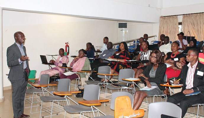Dr Kwadwo Appiagyei-Atua, Senior Lecturer at the School of Law, University of Ghana, interacting with participants in the workshop. Picture: MAXWELL OCLOO