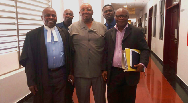 Mr George Lutterodt (right) with his lawyer Jeffrey Quist after the judgement