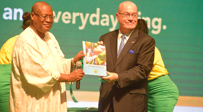 Mr Alex Segbefia (left), the Minister of Health, and Mr Robert P. Jackson, the US Ambassador to Ghana,­­ displaying a booklet  on the  "Good Life Brand " after relaunching it at the National Theatre in Accra. Picture by Emmanuel Quaye