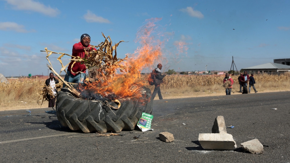  Police say at least 19 people were arrested in the capital Harare during portests [EPA] 
