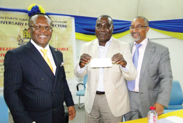  Mr Victor Quao, who is also the Chairman of the Planning Committee of the 85th anniversary displaying a donation of GHC10,000 received from Mr Felix Nyarko-Pong, CEO of Unibank for the Endowment Fund.