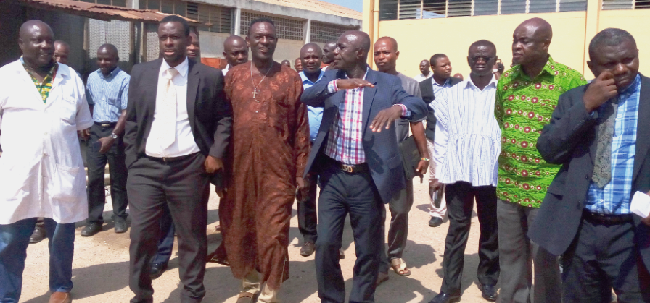 The Managing Director of the ISTC, Mr Samuel Nuamah Donkor, conducting members of the Parliamentary Select Committee on Transport round the company