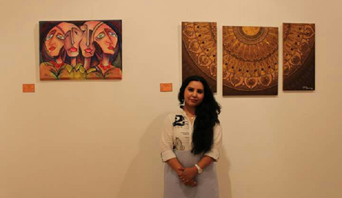 Rekha Bhardwaj displaying some of her paintings