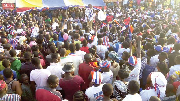 Nana Akufo-Addo (standing on stage) addressing a rally at Donkorkrom. Picture: SAMUEL TEI ADANO