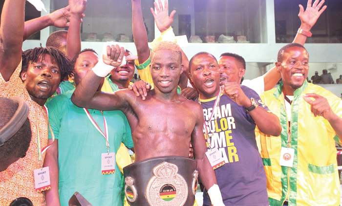   Sheriff Quaye (middle) celebrating his win with his handlers. Picture: BENEDICT OBUOBI