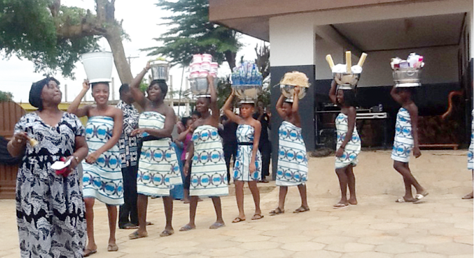 Ladies carrying items for the burial of Mrs Elizabeth Banful, mother of Dr Dick Banful, CEO, MEDIFEM Women's Hospital, Accra, and Prof. Rita Mensa-Bonsu, Director, LECIAD, Legon.