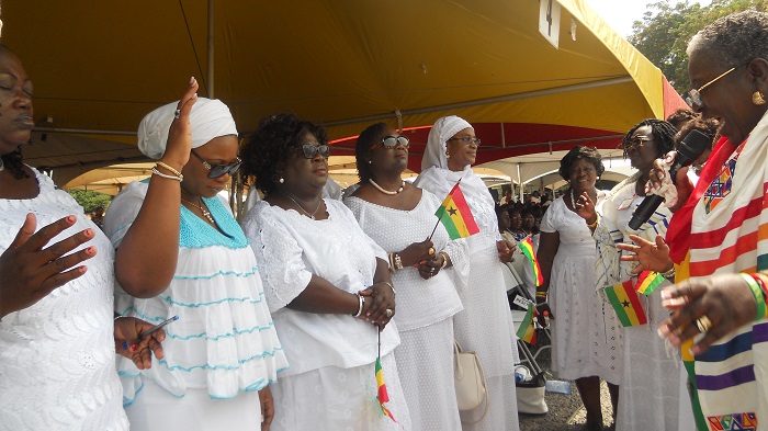 Mrs Gifty Affenyi-Dadzie (right), the National Prayer Director, Aglow, praying for Mrs Charlotte Osei (left), Chairperson of the Electoral Commission (EC). 