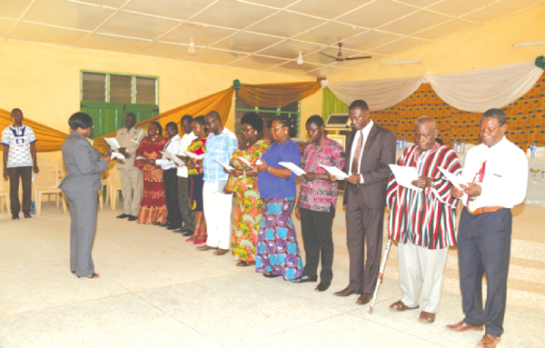  Madam Emelia K. Abruaquah, Magistrate of Somanya Magistrate Court, swearing in the new board.