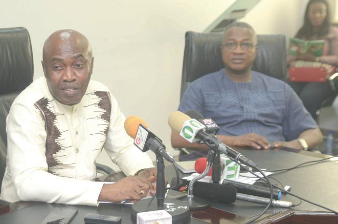   Mr Nathaniel Otoo (right), Chief Executive of the National Health Insurance Authority (NHIA), launching the NHIA  new product  in Accra yesterday.Picture: Emmanuel Quaye 