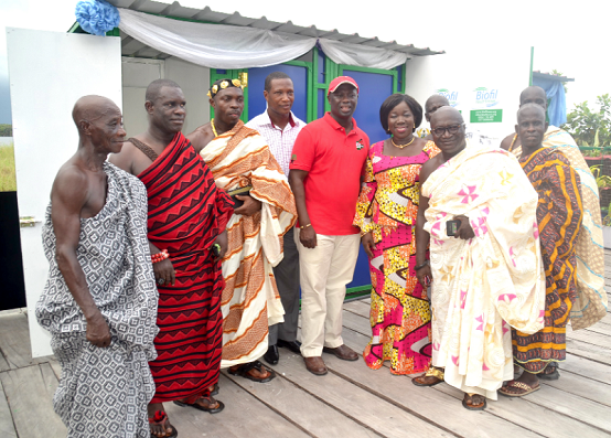 Elizabeth Ofosu Adjare (4th right) with some chiefs from Nzulezu infront of the facility