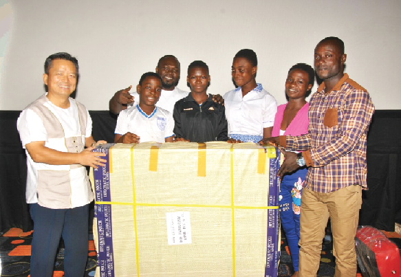 Members of the Great Counselor International School Taekwondo Club receiving their prize from Mr Woon-Ki Lyon (left), the Korean ambassador