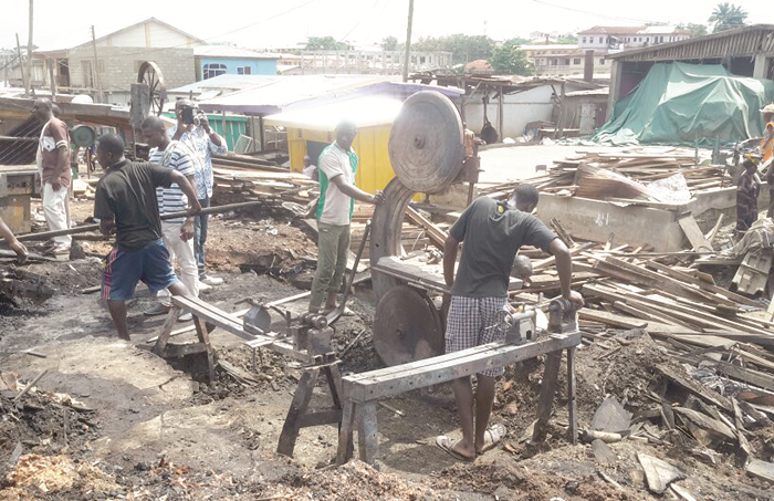  Some shop owners trying to salvage items after the fire outbreak. Picture: DONALD ATO DAPATEM