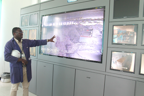 Mr Samuel K. Ntumy, Plant Engineer, ACARP, explaining how the control room where various plants are monitored works during a visit to the facility