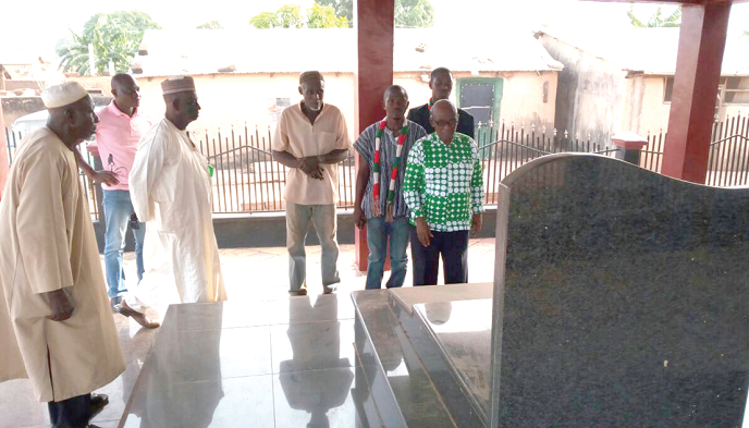 Prof. Delle (right) with some elders of the CPP at the tomb of Dr Hilla Limann, former Head of State.