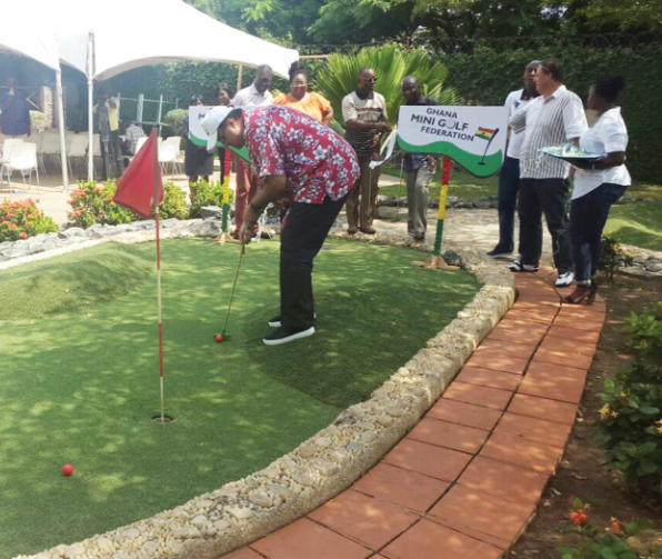 GMF President Talal Fattal playing minigolf at the Marvels Club.