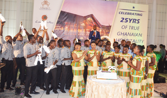 Staff of the hotel popping champagne to celebrate the evening
