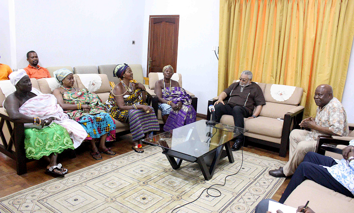  Mamaga Maamele of Klikor (2nd left) explaining a point to Former Presiddent Rawlings