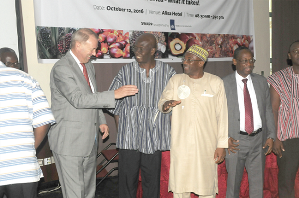Dr Ahmed Yakubu (2nd right), Deputy Minister of Food and Agriculture, interacting with Mr Ron Strikker (left) and Mr Emmanuel Ahiable after the conference