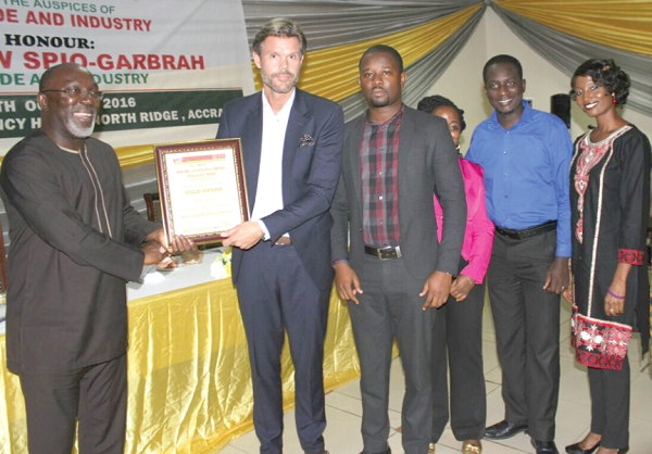 Mr Papa Kow-Bartels (left), Director of Industries at the Trade Ministry, presenting the award to Mr Sjodin and other members of staff of Inesfly