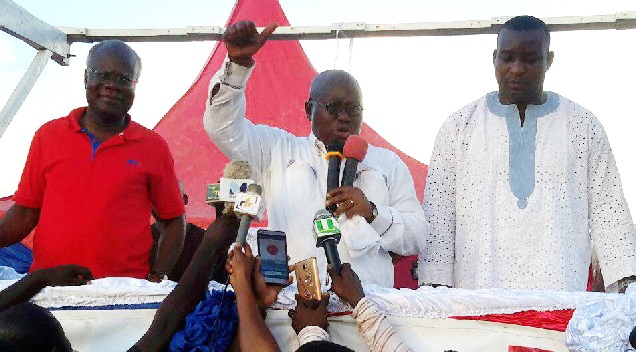 Nana Akufo Addo(middle)  addressing  a mammoth rally at Abbey's Park in Kumasi.With him are Mr K.T.Hammond and Mr Antwi Boasiko (right)