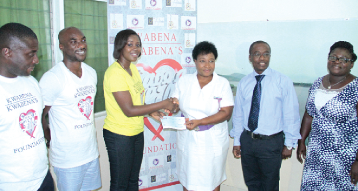  Kwabena Kwabena (2nd left) and his team making the presentation