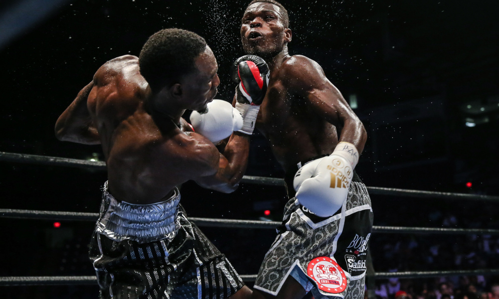 Easter landing a hard uppercut on Commey