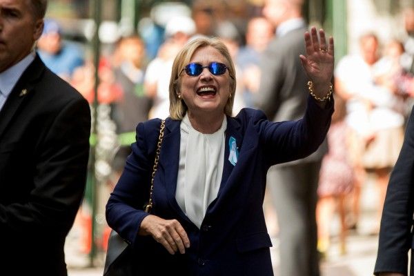 Mrs Clinton waved to photographers after she left her daughter's home in New York