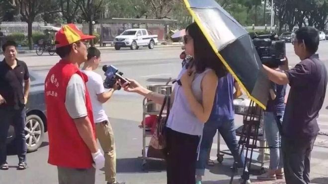  Did the journalist damage her profession with her umbrella and sunglasses 