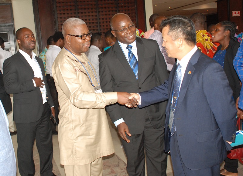 Mr.Twumasi-Ankra Selby(second left)Chief Director,MOT exchanging greetings with Mr.Lyeo Woon-Ki(right)Korean Ambassador to Ghana.With them is Mr Godwin Brocke.