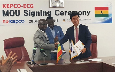 The Managing Director of the ECG, Mr Robert Dwamena, and the Vice-President and Chief Global Business Officer of KEPCO, Mr Bong–soo Ha, in a handshake after the signing of the agreement.