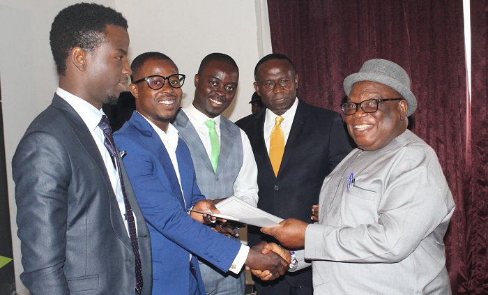 Adams Muhammed Muhideen (2nd left) – Trotro Tractor (one of the winners) receiving the awards from the Deputy Minister of Petroleum, Mr Ben Dagadu. With them is Mr Joe Mensah (2nd right).