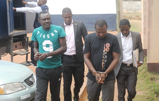 Lance Corporal Daniel Kissi Abrokwah (left) and Hafisu Muhammad being escorted to the court room by the CID personnel at the Accra Magistrate, Accra. Picture: KWABENA ASAMOAH ADDAI