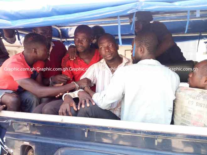 The seven suspects were taken to the court in handcuffs by armed police from the Central Regional Police Headquarters. PICTURES BY TIMOTHY GOBAH
