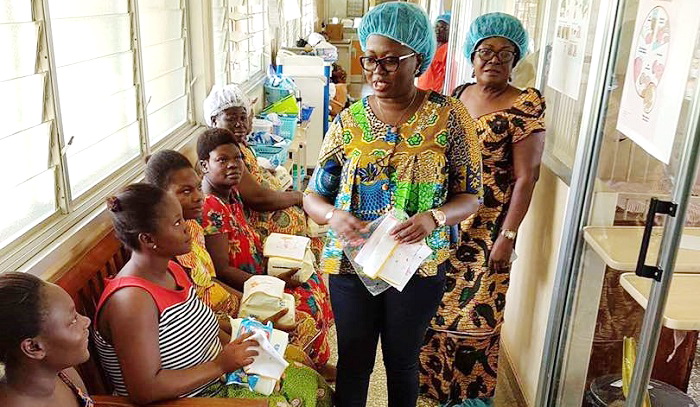 Ms Amma Frimpomaa (arrowed)  interacting with some mothers at the hospital