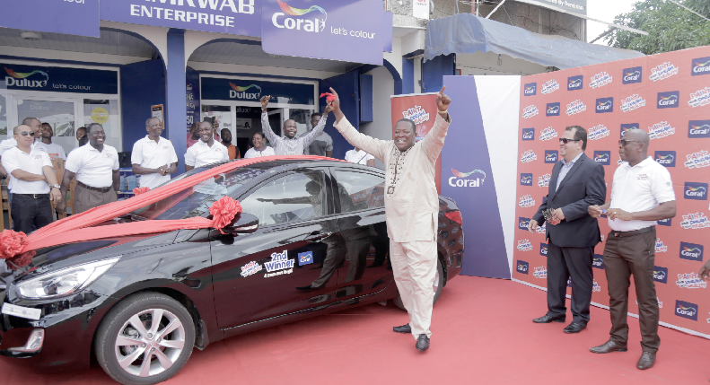 Mr Mensah Koevi (3rd right) celebrating by his new car. Also in the picture include Mr Yaw Bonnah-Sarpong (right), the General Manager of M&amp;K Ghana Ltd. and Mr Luiz Carlos Da Silva (2nd right), the Business Development Manager of Coral.